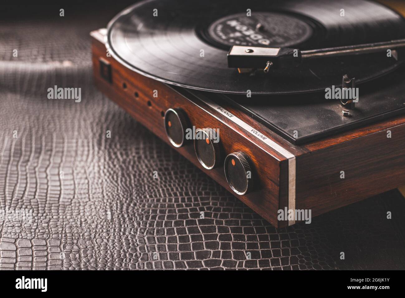 Record player with vinyl disc on table in room Stock Photo - Alamy