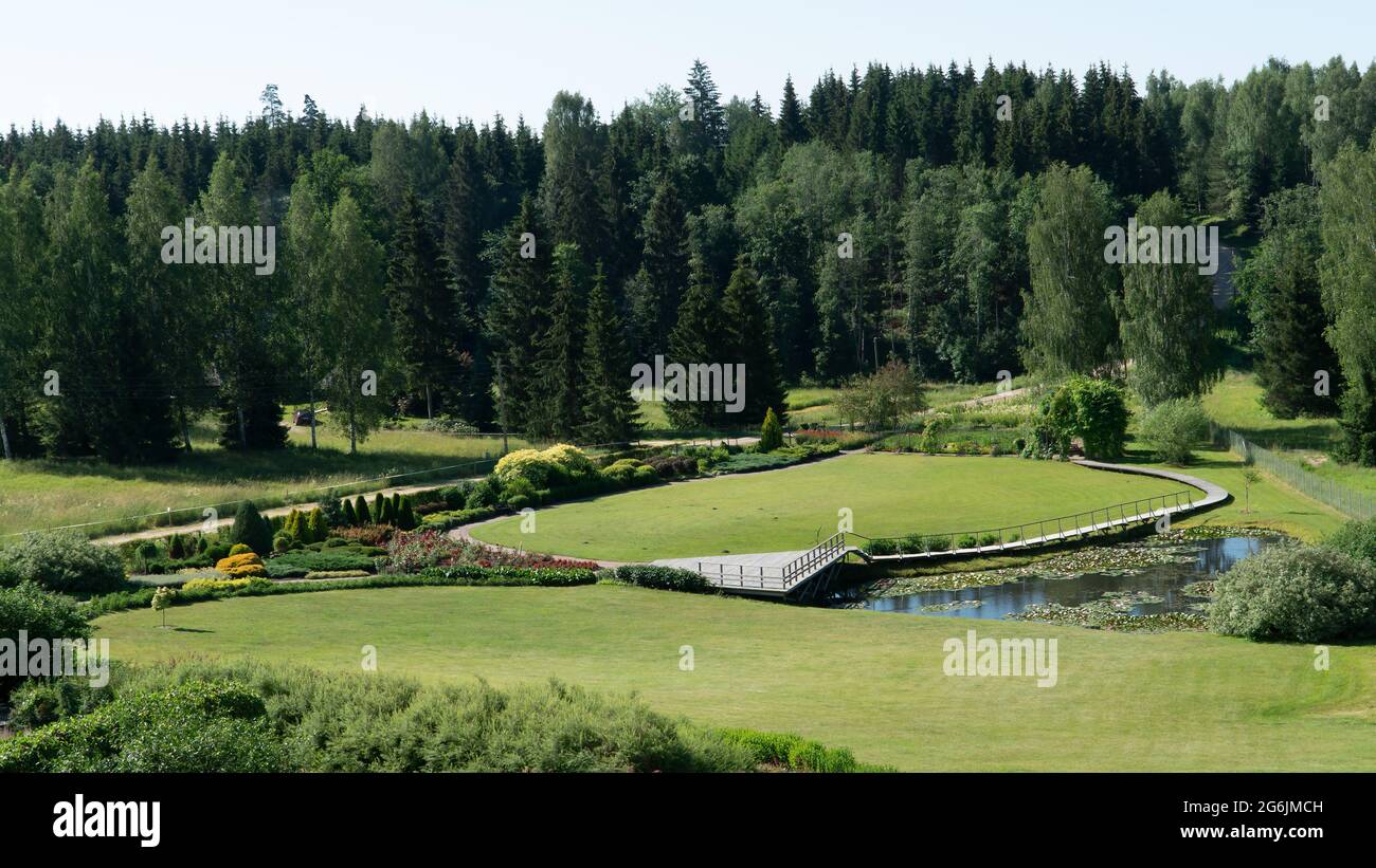 The garden in a hotel territory. Landscape design of landscaped territory in a rural area in the territory of Latvia. Stock Photo