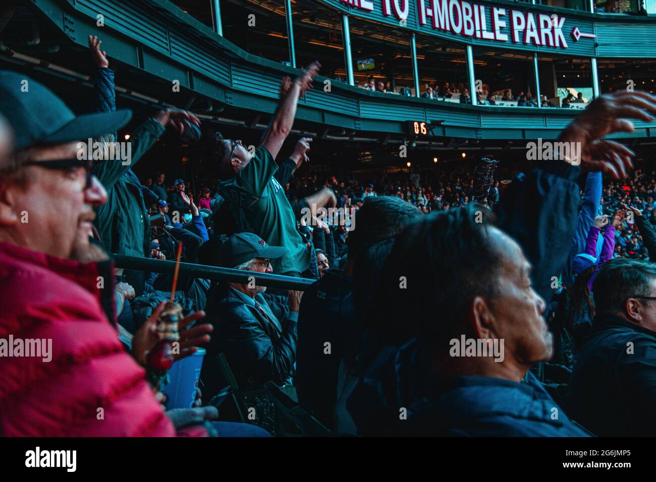 Crowd doing the wave during an MLB game Stock Photo