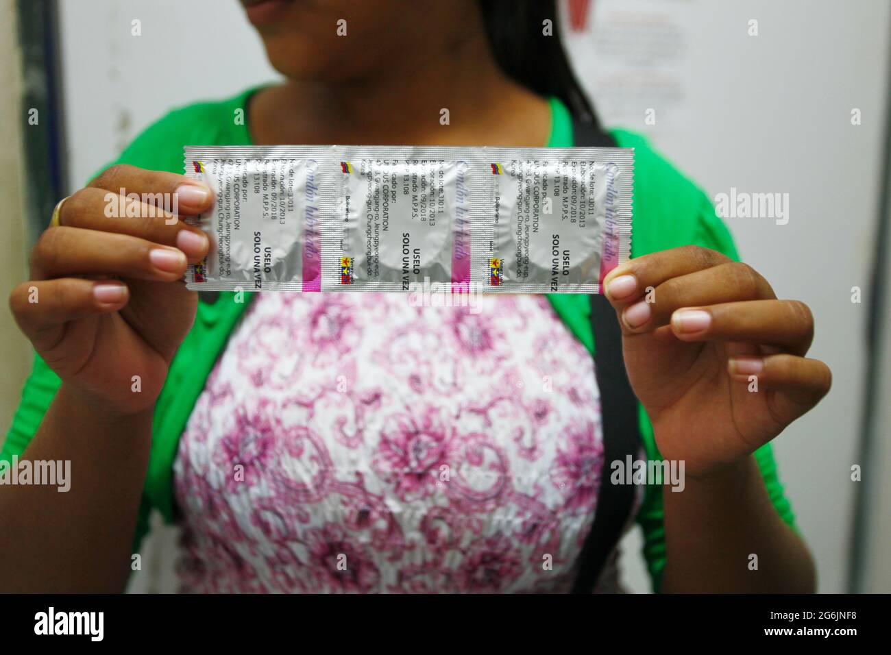 Maracaibo- Venezuela-19-06-2015-Maternity Castillo Plaza A single mother shows condoms to prevent pregnancy, when leaving a postpartum.Photo José Bula Stock Photo