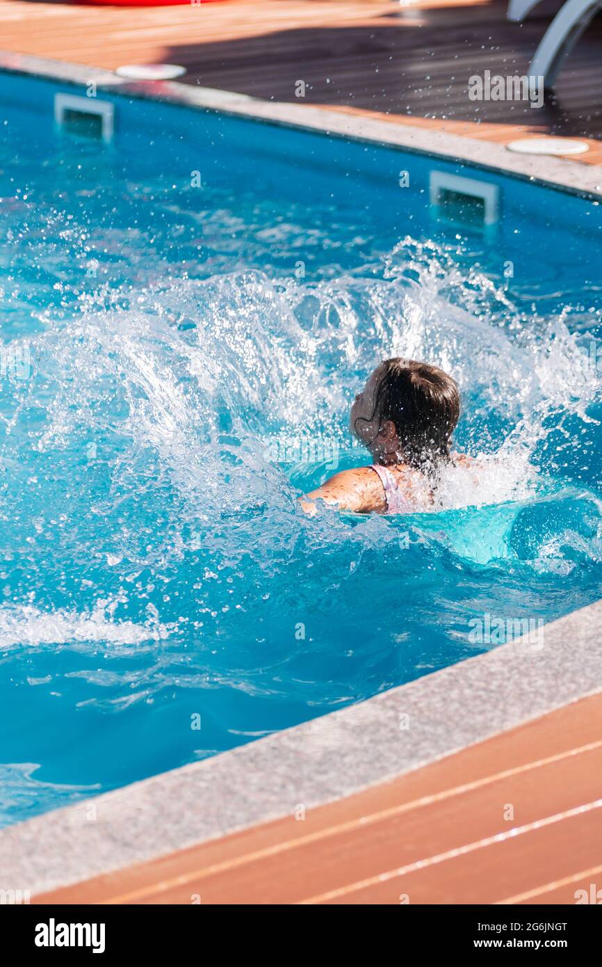 Child girl jump swimming pool hires stock photography and images Alamy
