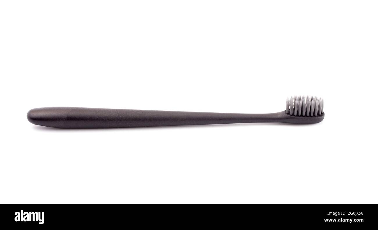 A Black Toothbrush without Toothpaste on a White Background Stock Photo
