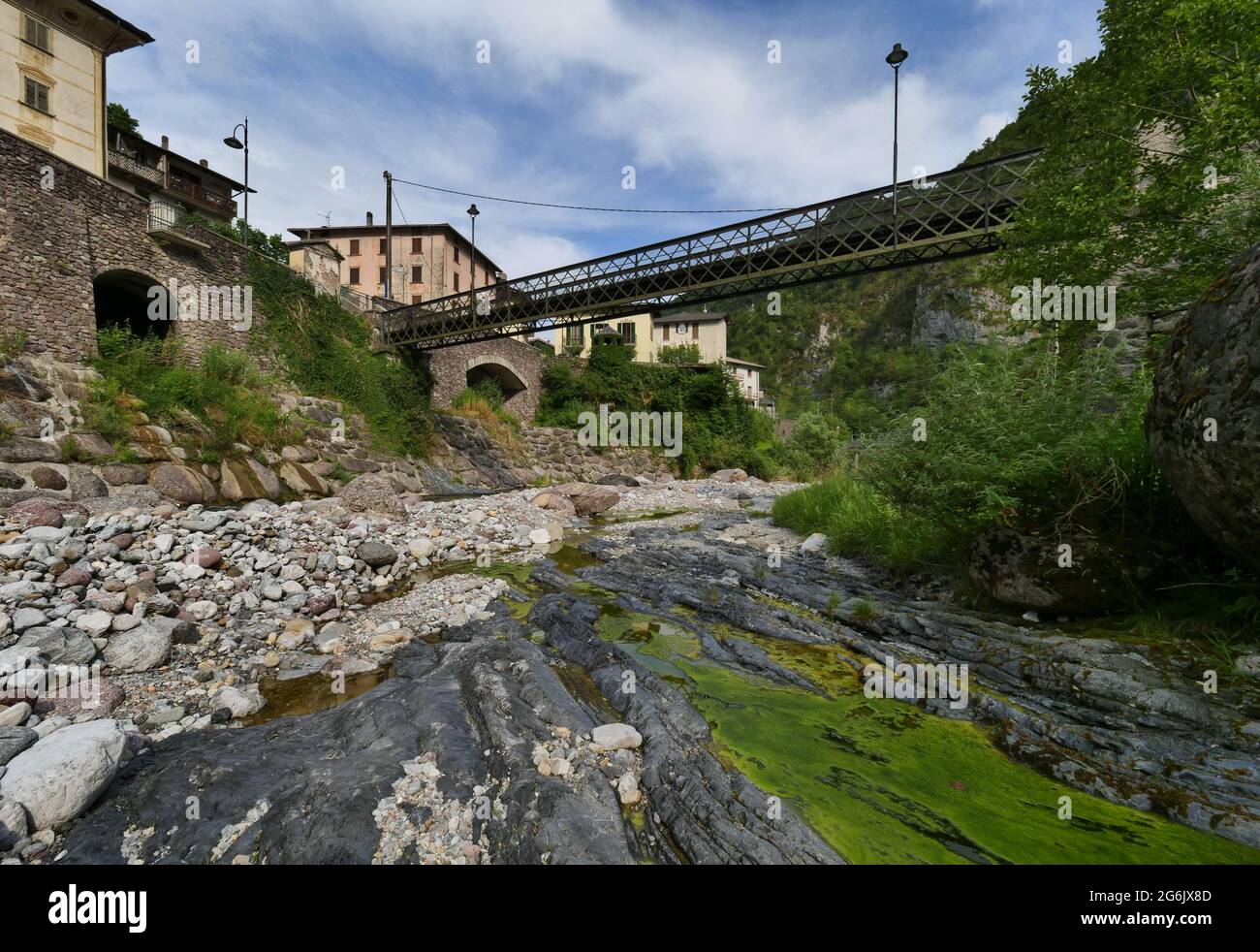 Bridge in small town of the Cassiglio 113 inhabitants in Brembana Valley Bergamo, Italy Stock Photo
