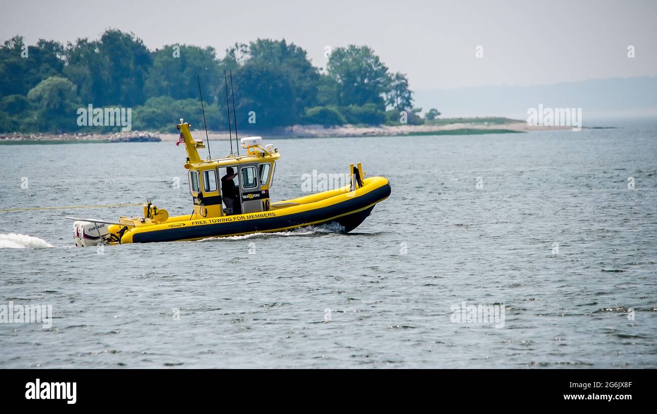 NORWALK, CT, USA - JULY 6, 2021: Towing boat service near Calf Pasture beach Stock Photo