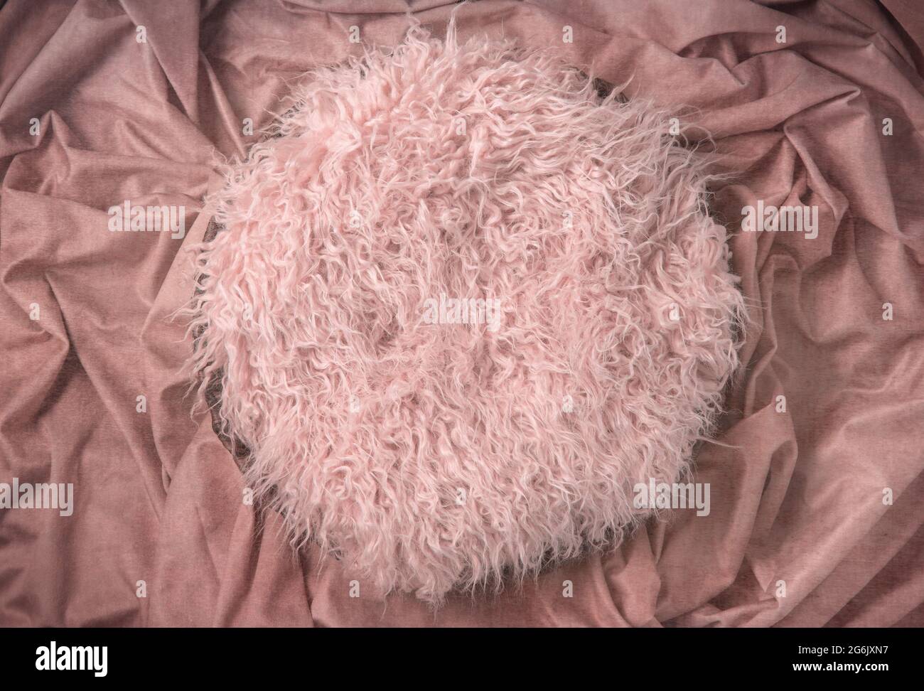 Pink Fur on Crushed Fabric Newborn Backdrop for Photographers with a Single Light Setup Stock Photo