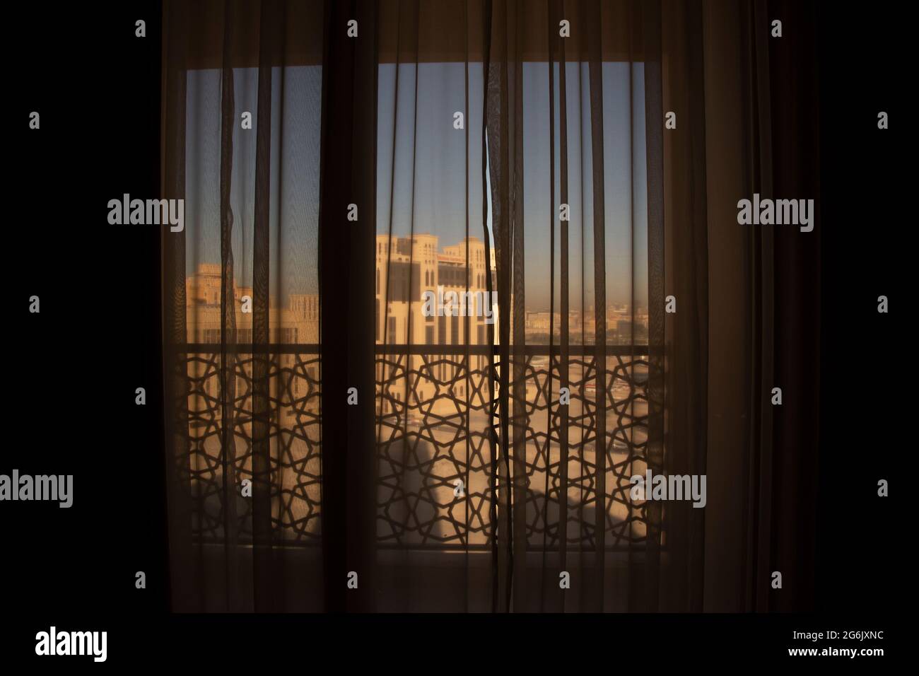 Seeing the early morning sunshine through the curtains in Dubai. Stock Photo