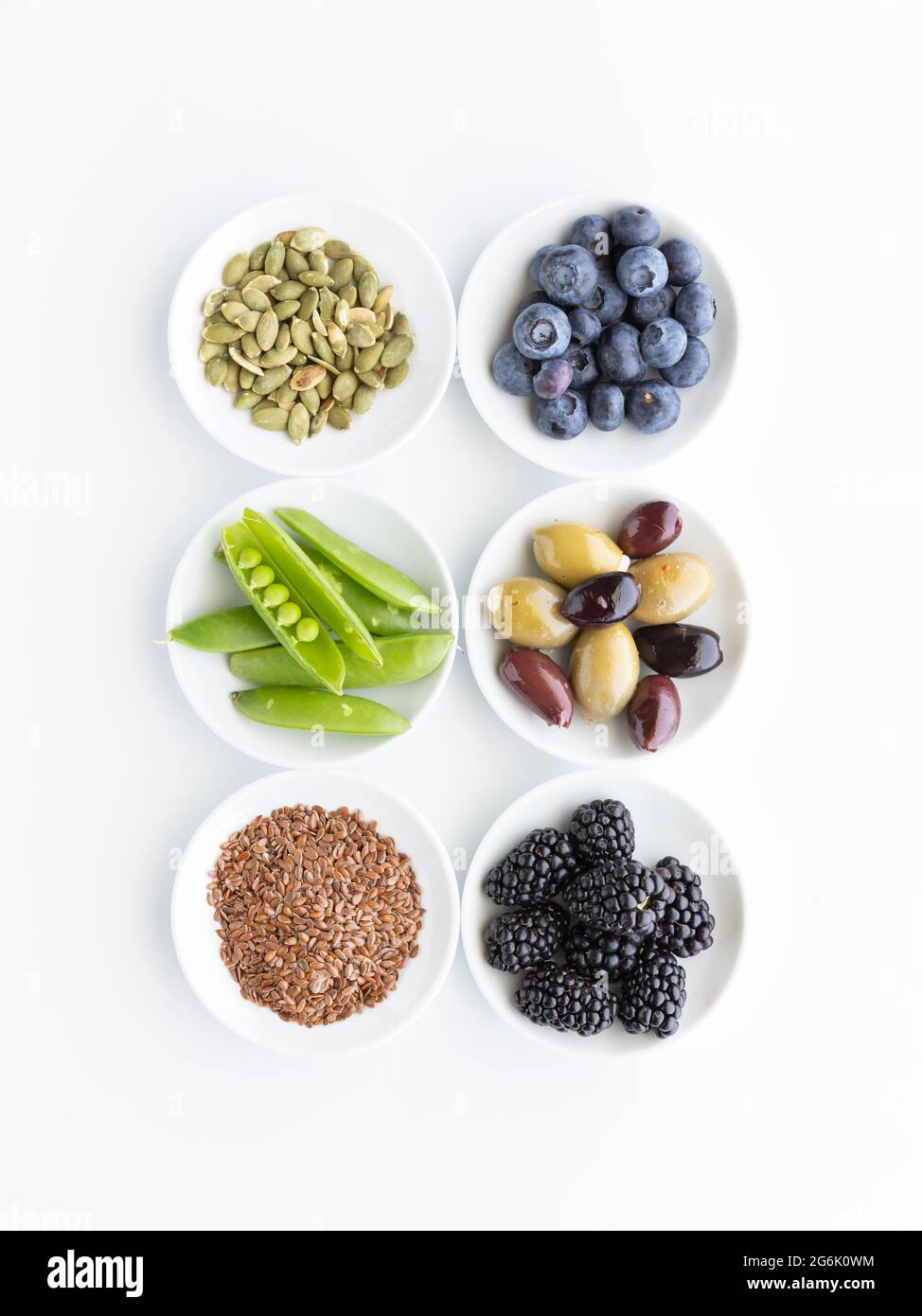 Top down view of small bowls filled with various healthy raw