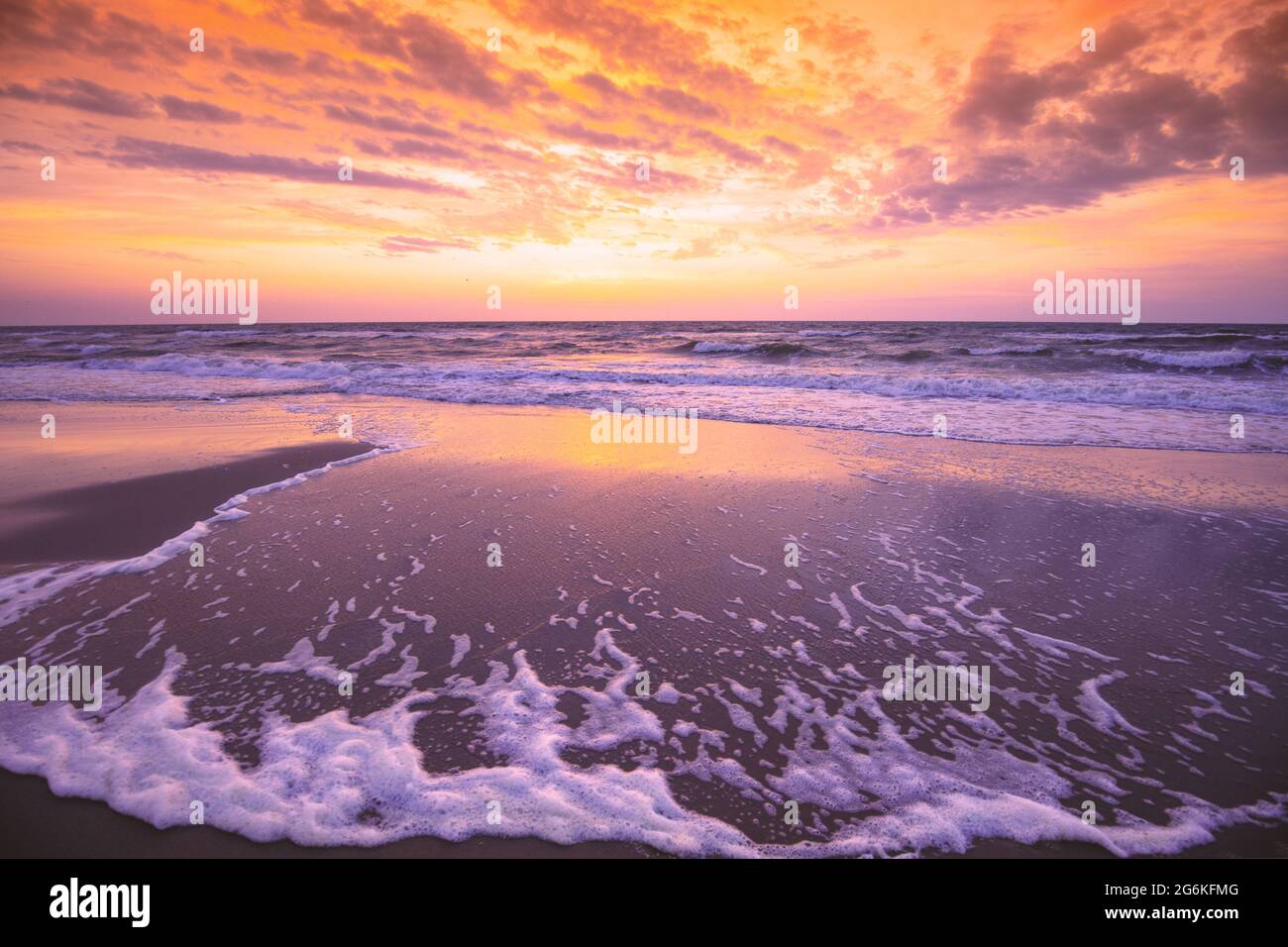 Seascape in the evening. Sunset over the sea with the beautiful blazing ...