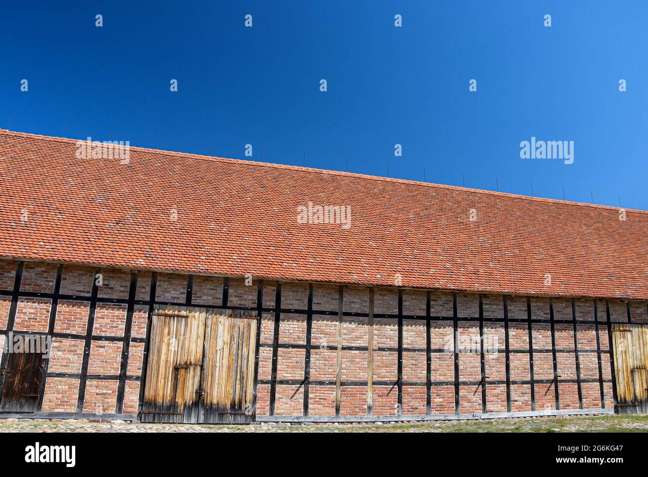 Old farm building  situated in open-air museum in Wdzydze Kiszewskie. Half - timbered facade. Stock Photo
