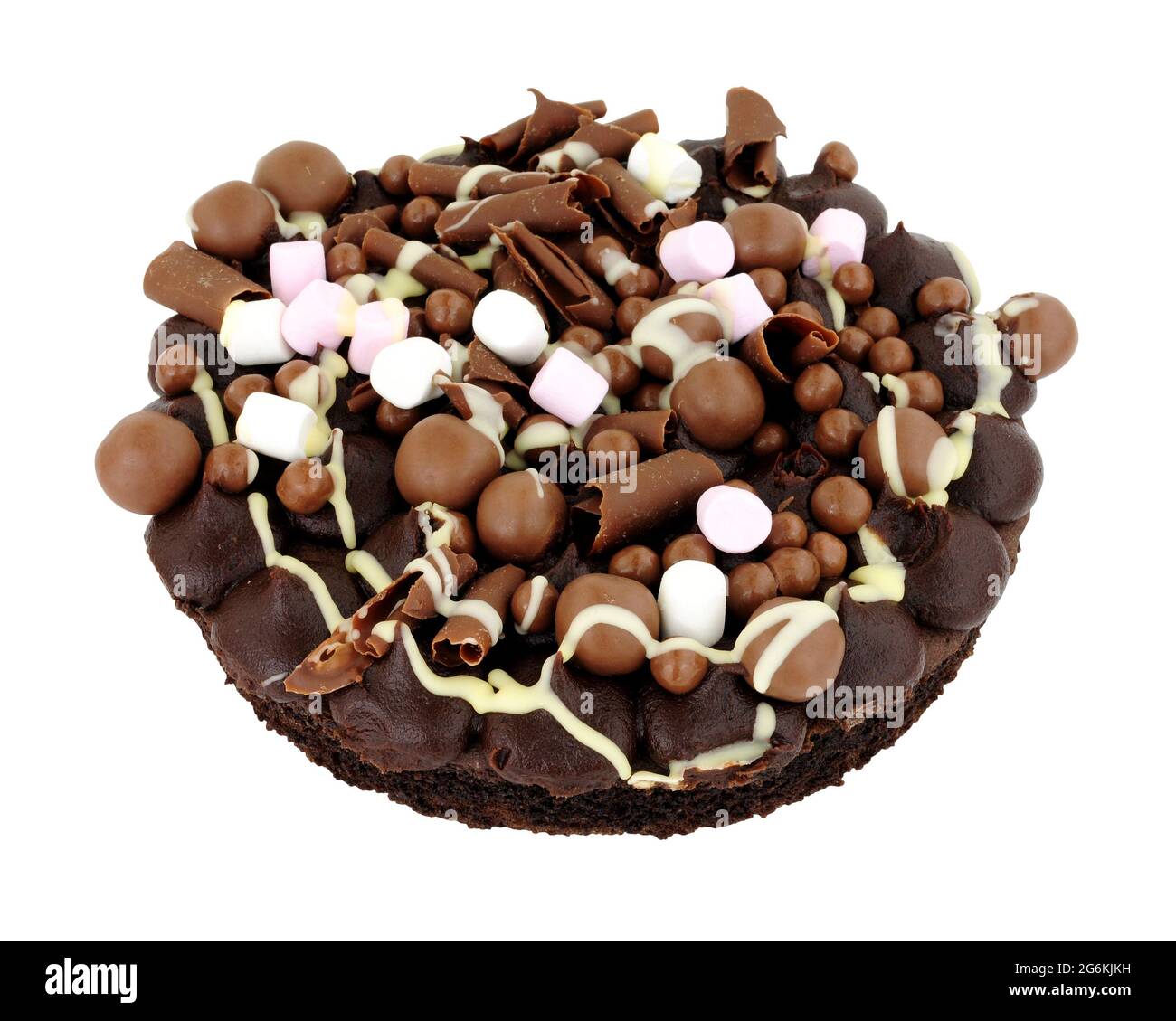 Chocolate rocky road dessert sponge cake decorated with chocolate balls and marshmallows isolated on a white background Stock Photo