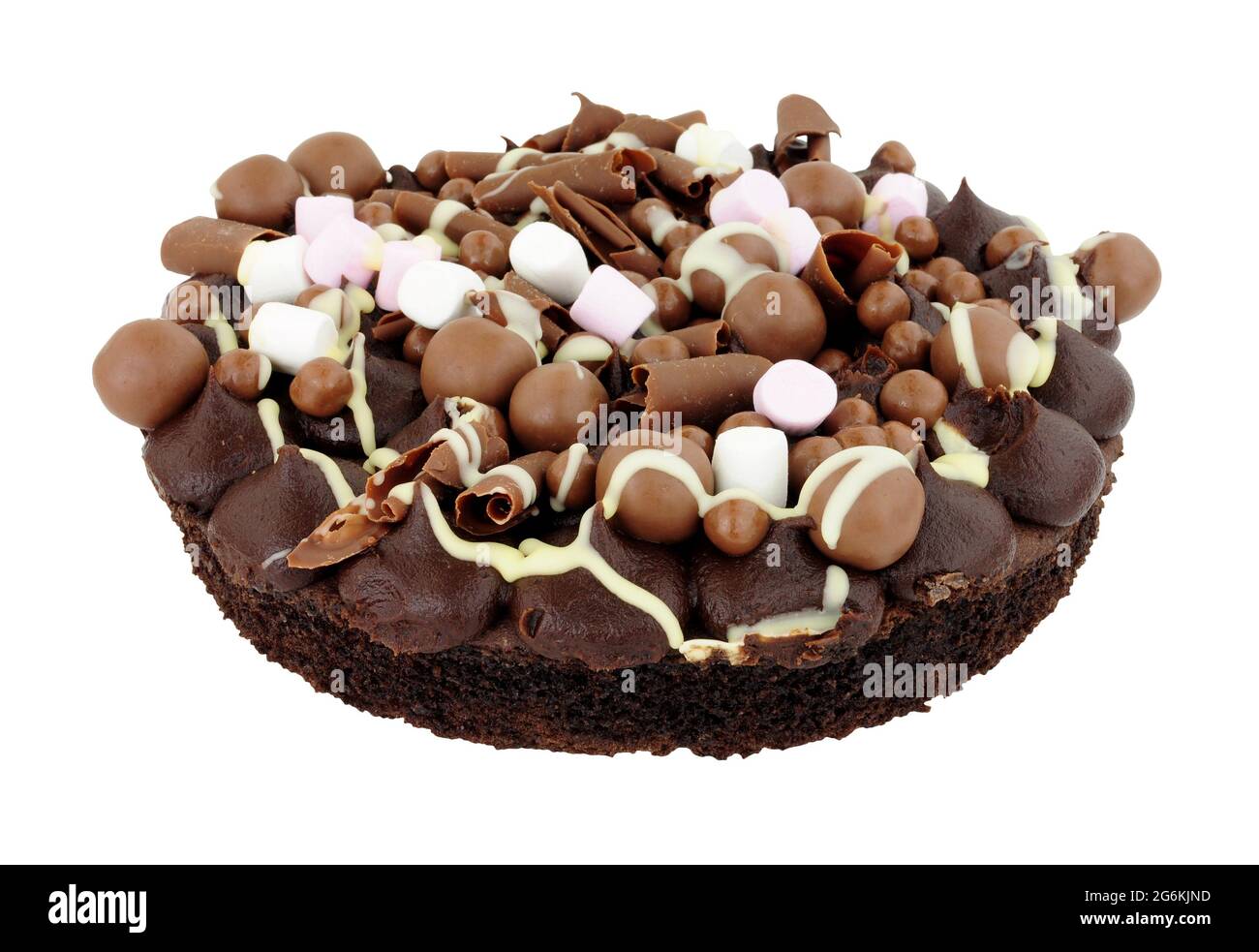 Chocolate rocky road dessert sponge cake decorated with chocolate balls and marshmallows isolated on a white background Stock Photo