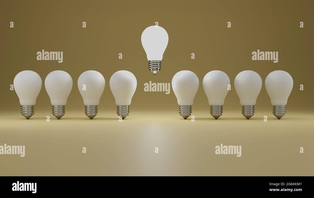 Think different concept a floating glowing idea light bulb standing out from dim unlit bulbs on yellow pastel color wall background leadership and ind Stock Photo