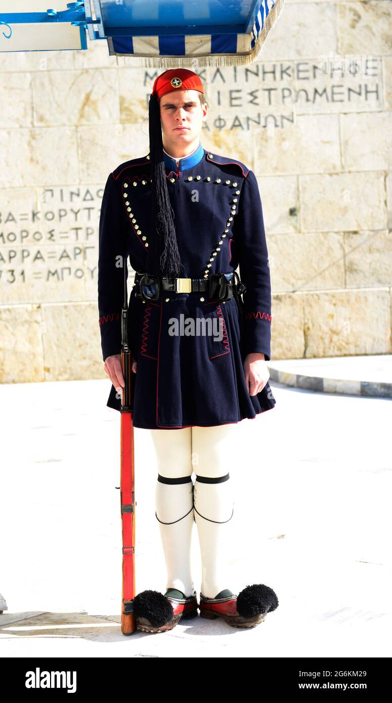 A Greek national guard soldier standing by the tomb of the unkown soldier at the Greek Parliament in Athens, Greece. Stock Photo