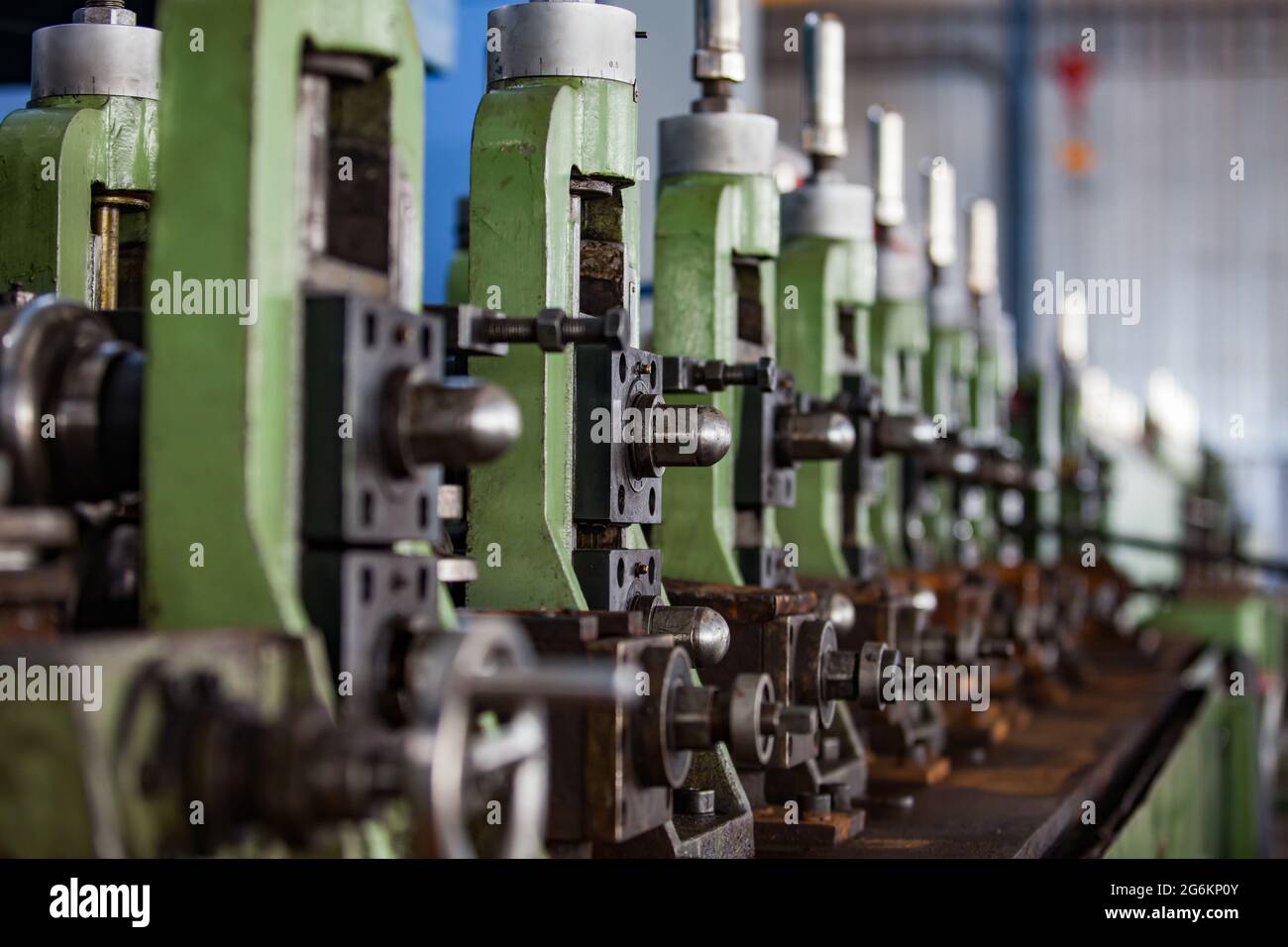 Abstract image of metalworks machine. Green steel parts and grey bolts. Stock Photo