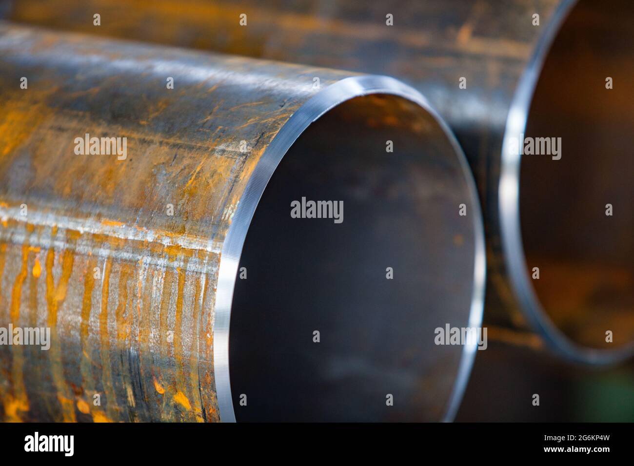 Close up photo of two rusted pipes with new facets after machining. Prepared to connect by welding. Low depth-of-field. Stock Photo