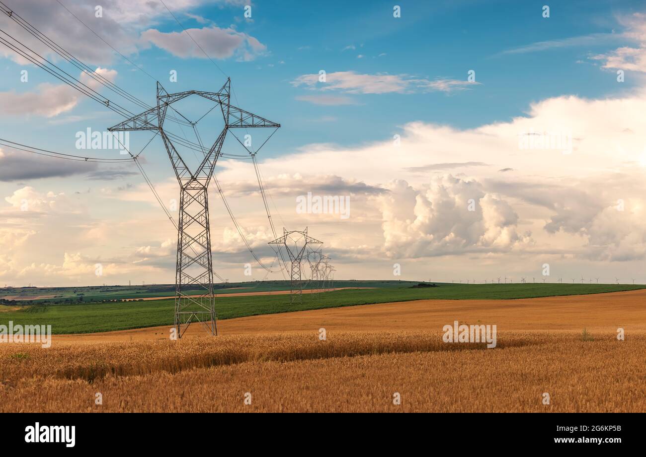 Electric power lines and agricultural fields. High voltage electric