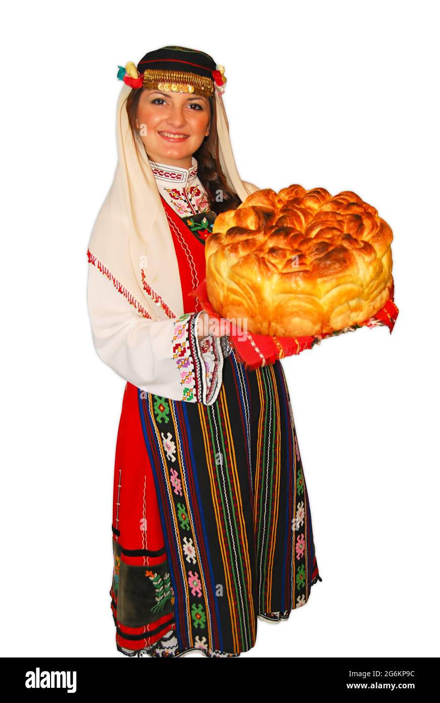 Young girl peasant with traditional Bulgarian folklore costume and sourdough bread in hand portrait isolated Stock Photo