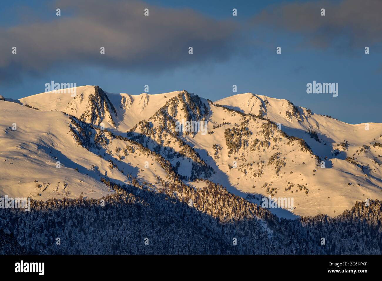 Aran Valley in a winter sunrise after a snowfall, seen from the village of Mont (Aran Valley, Catalonia, Spain, Pyrenees) Stock Photo