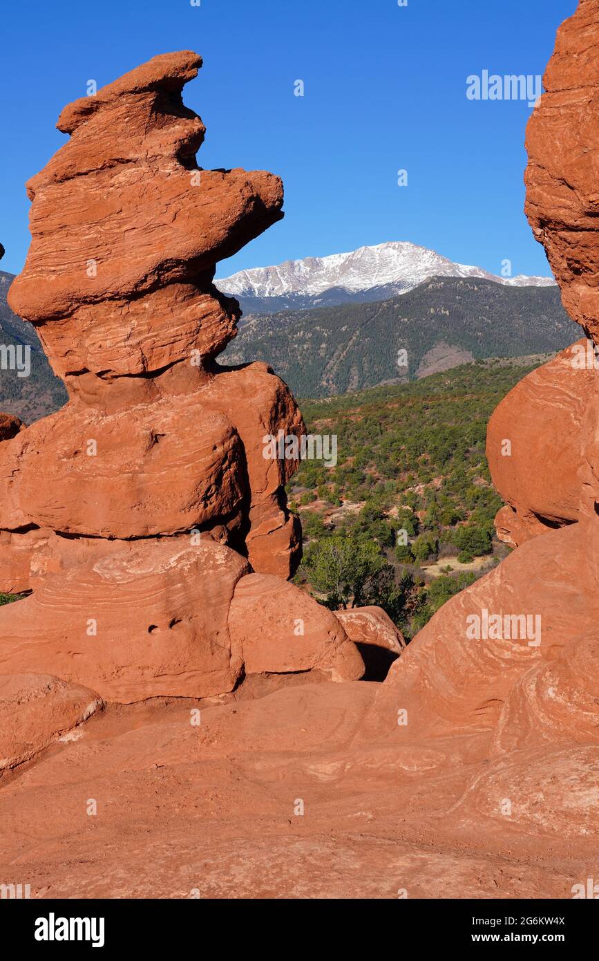 View Of Pikes Peak Through The Hole In The Siamese Twins Red Rock Formation In The Garden Of The Gods Park In Colorado Springs Colorado United State Stock Photo Alamy