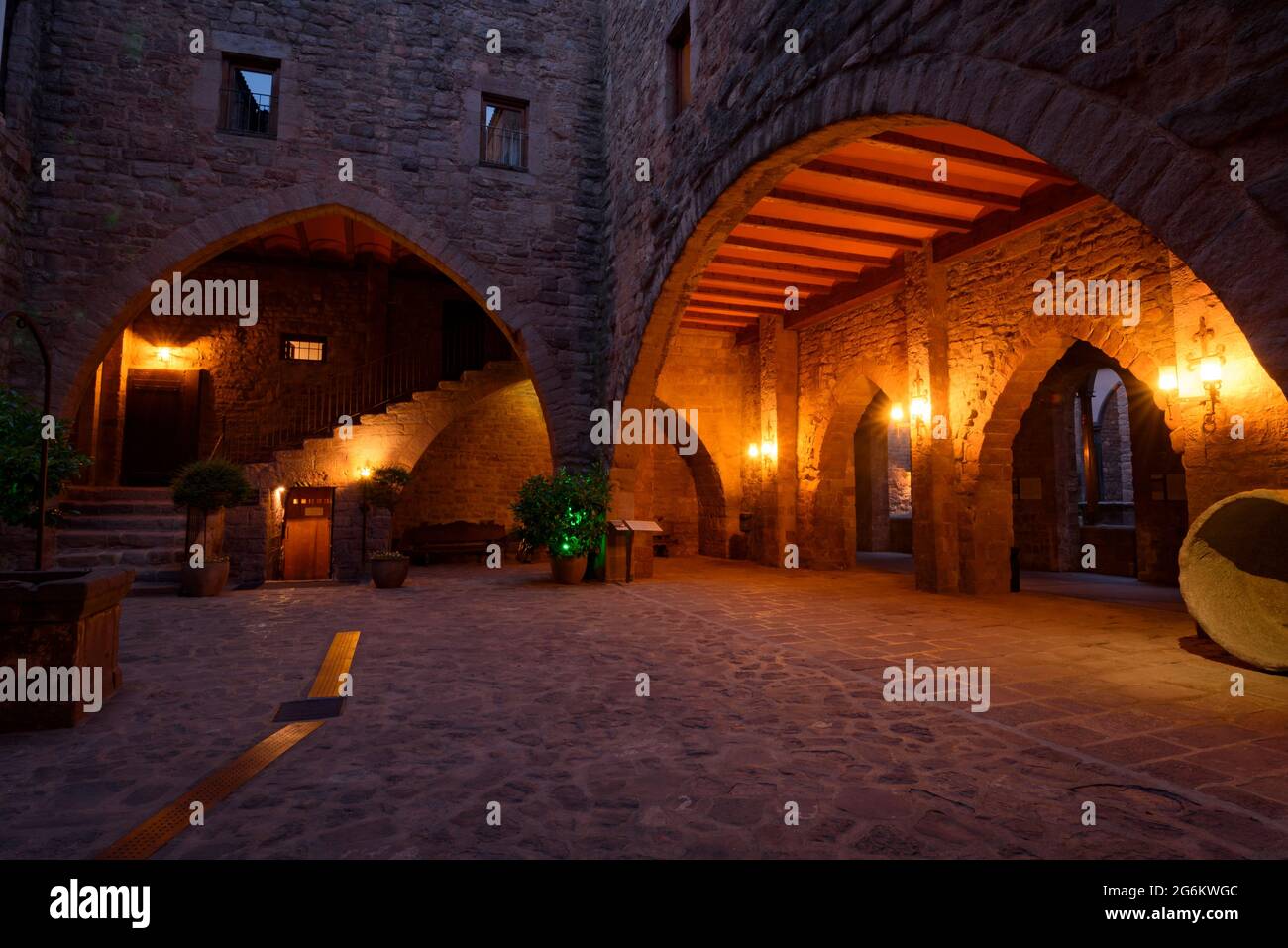Inner courtyard of the Parador Nacional (luxury hotel) at night, within the Castle of Cardona (Bages, Barcelona, Catalonia, Spain) Stock Photo