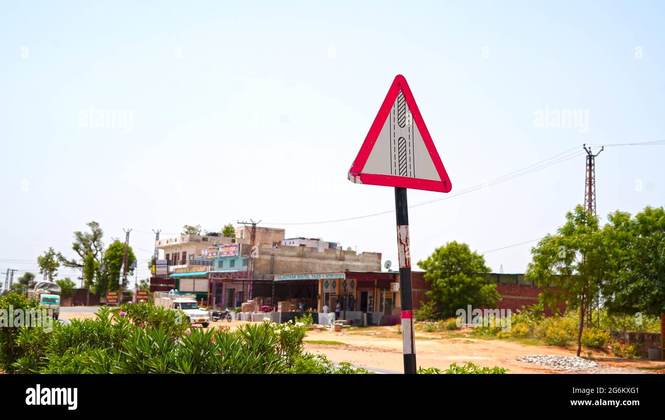 07 July 2021- Reengus, Sikar, India. Mid road break out sign board with