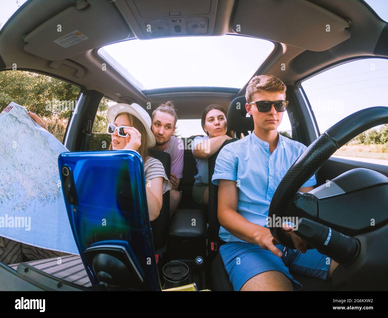 group of friends in car road trip concept Stock Photo - Alamy