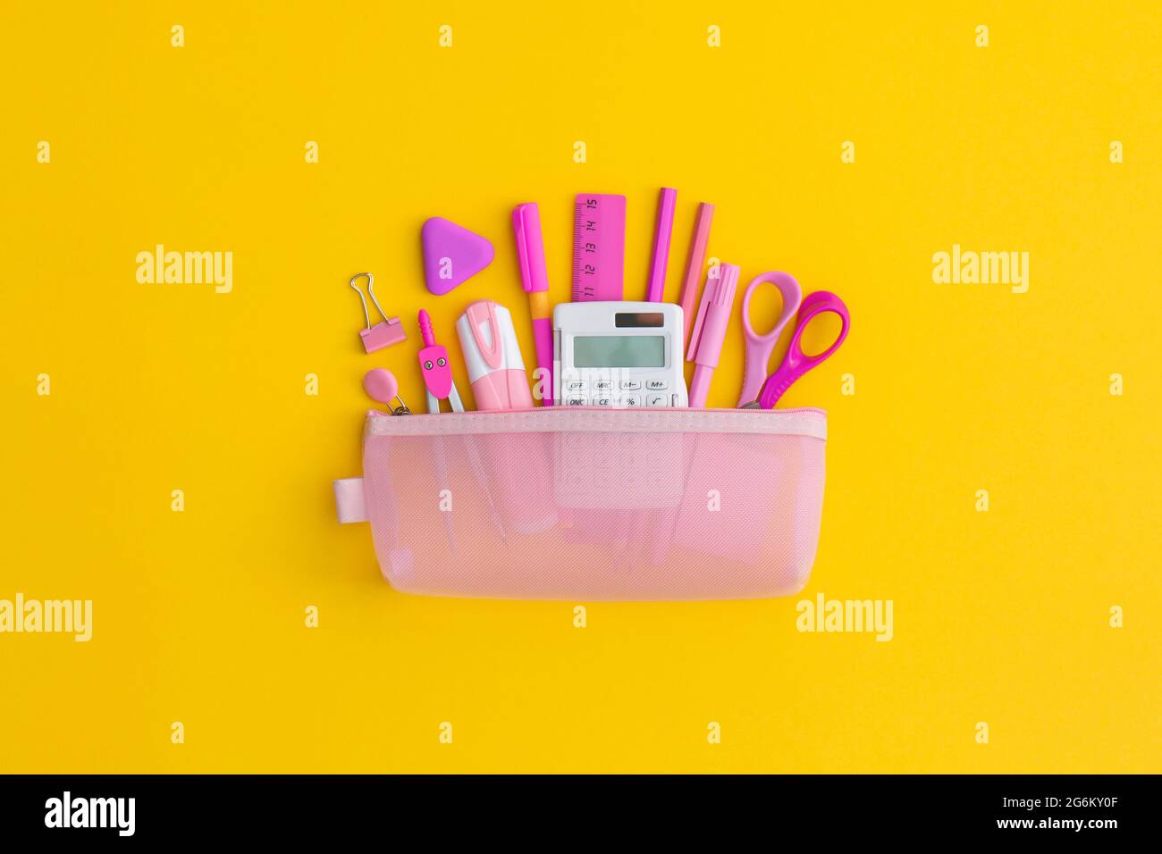 Pencil case with school stationery on a yellow background. Top view. Flat lay. Back to school concept. Stock Photo