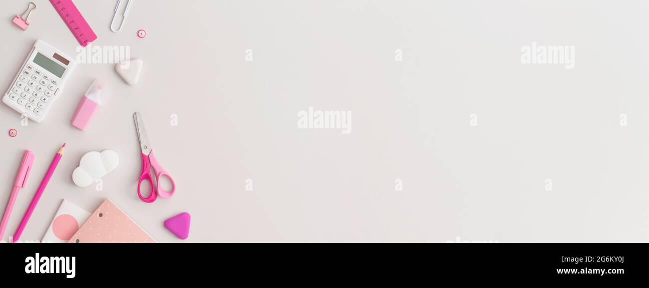 Pink school stationery on a grey background. Top view. Flat lay. Back ...