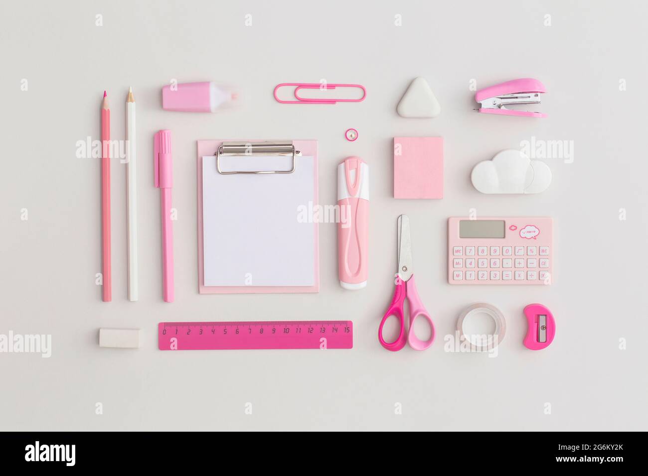Pink school stationery on a grey background. Top view with copy space ...