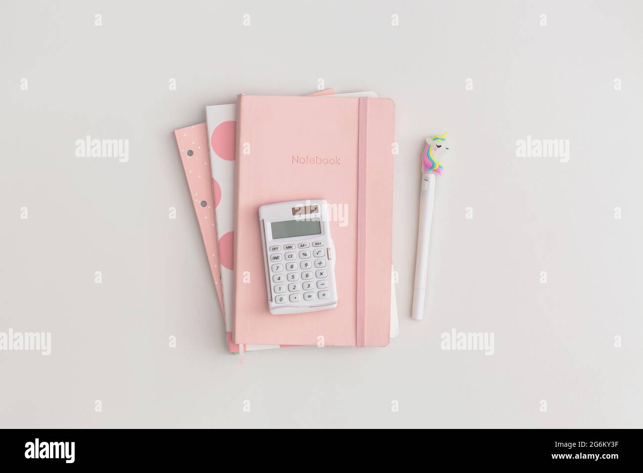 Pink school stationery on a grey background. Top view with copy space ...
