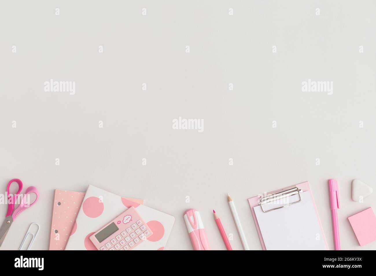 Pink school stationery on a grey background. Top view. Flat lay. Back ...