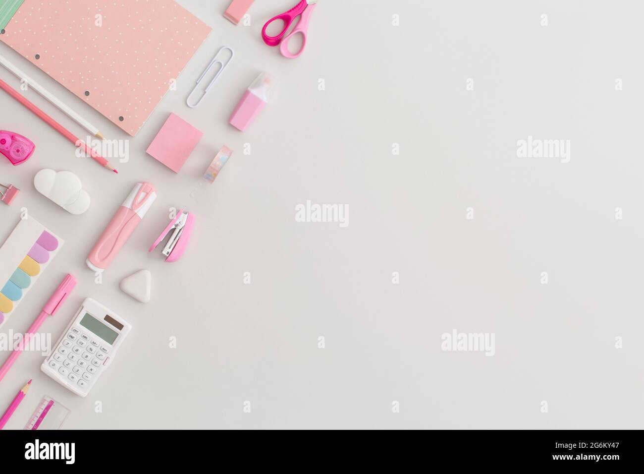 Pink school stationery on a grey background. Top view. Flat lay. Back ...