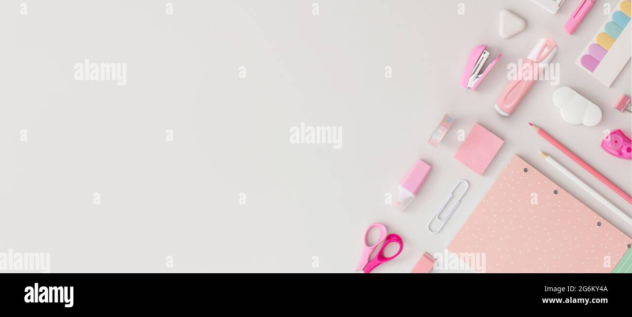 Pink school stationery on a grey background. Top view. Flat lay. Back ...