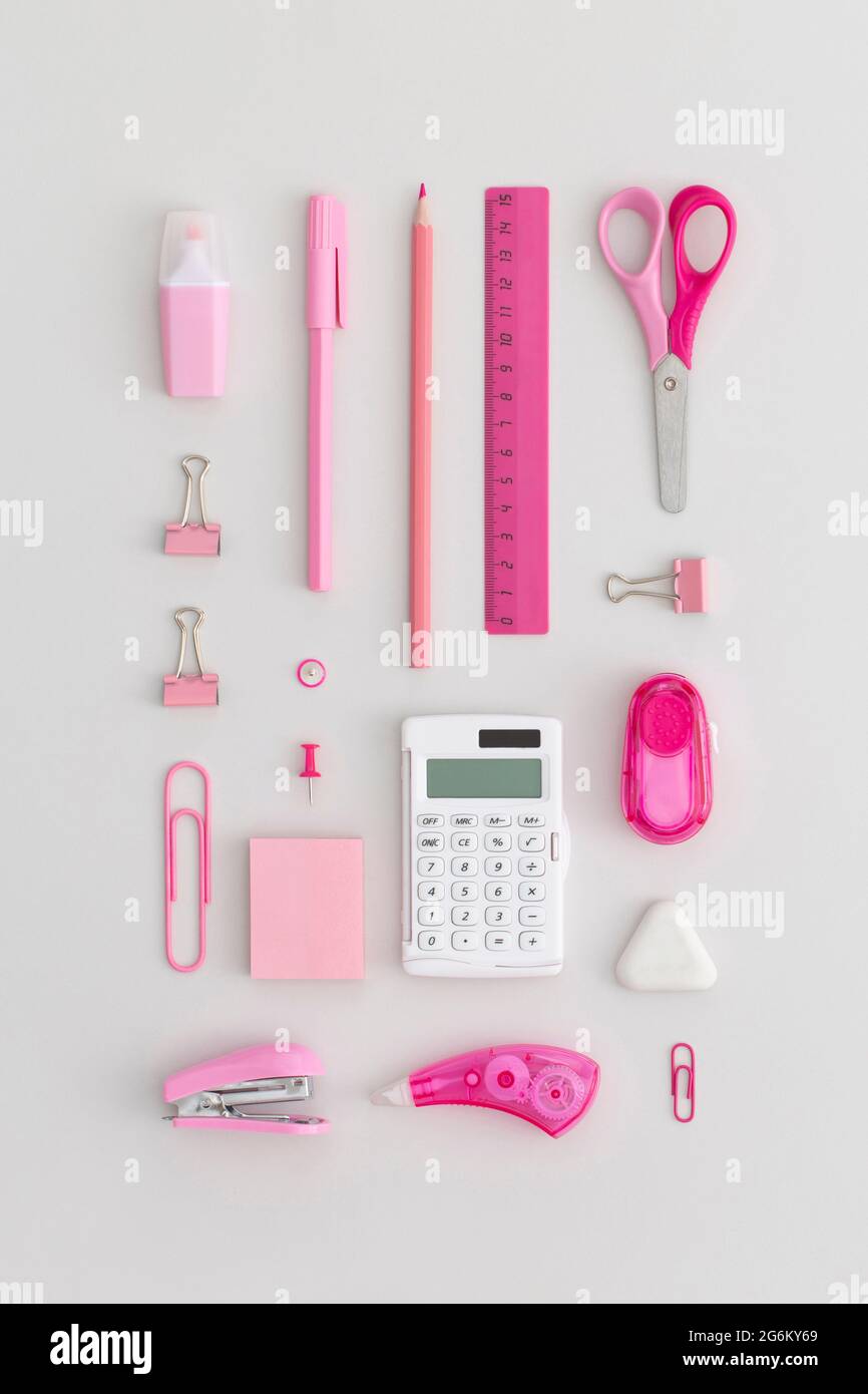 Pink school stationery on a grey background. Top view. Flat lay. Back ...
