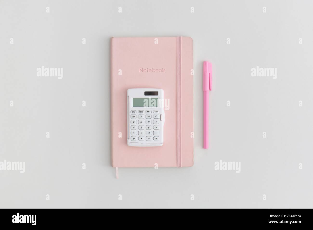Calculator, notebook and pen on grey background. Top view. Flat lay. Back to school concept. Stock Photo