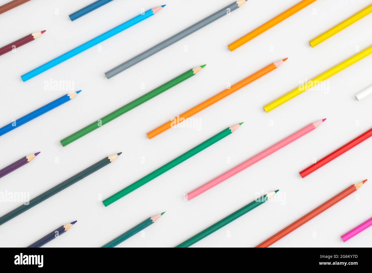 Pattern composition of colored pencils on a grey background. Top view