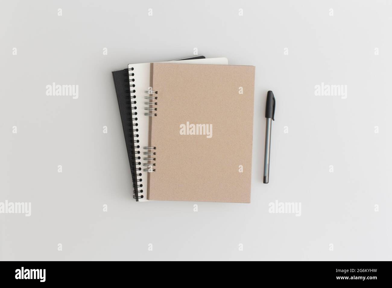 Notebook on grey background. Flat lay composition. Top view. Stock Photo