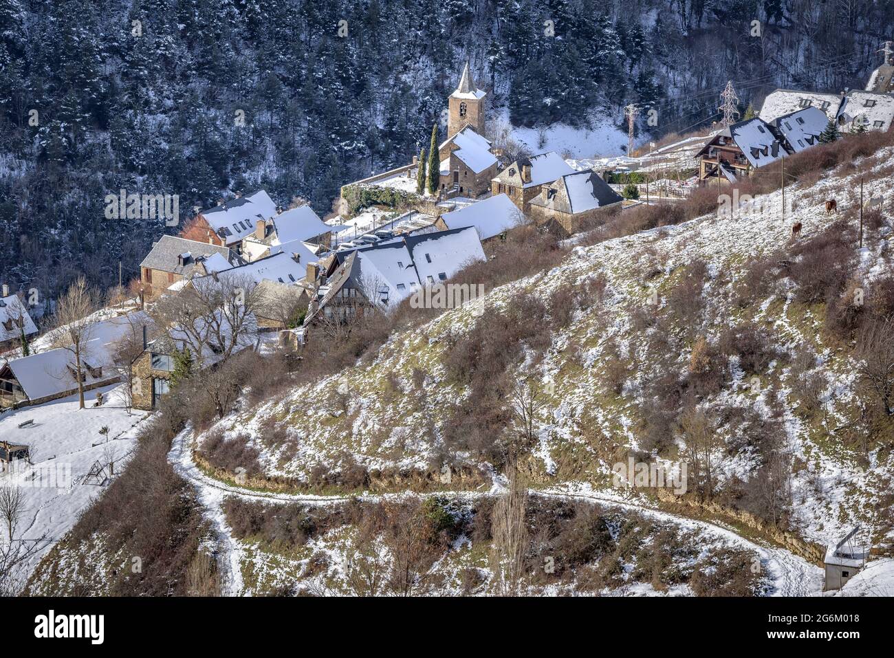 Snowy Aran Valley in winter, seen from the village of Mont. In the foreground, Betlan village (Aran Valley, Catalonia, Spain, Pyrenees) Stock Photo
