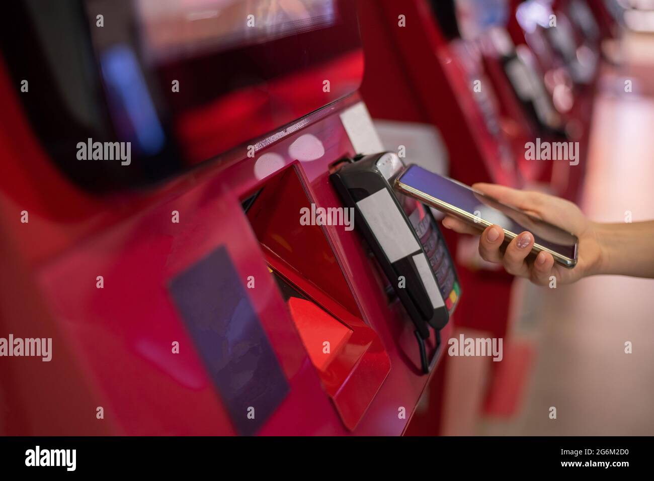 Face Less Machines Faceless caucasian woman pays at selfservice machine with contactless ...