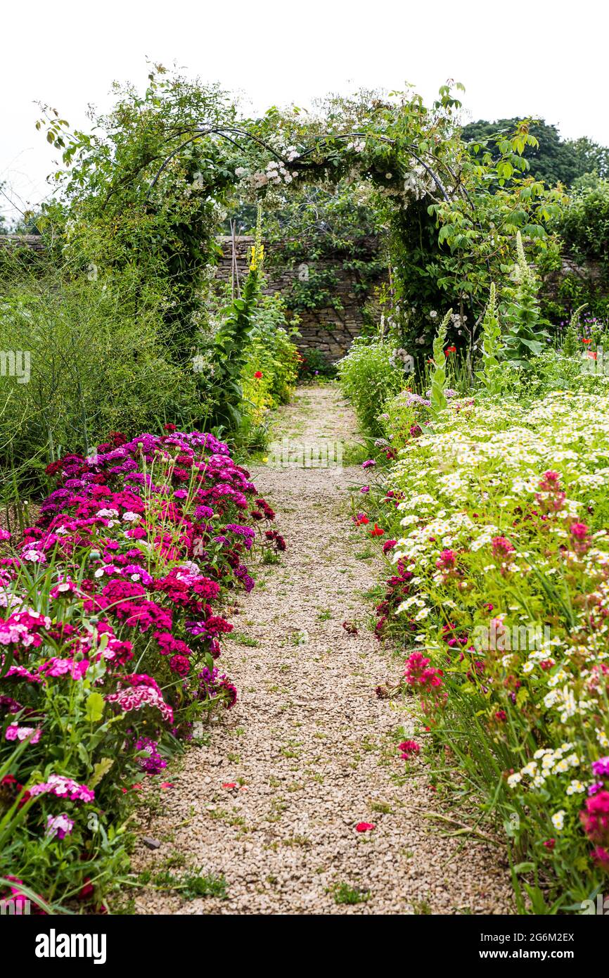 Shingle path through the walled kitchen garden at Cogges museum, Witney. Stock Photo