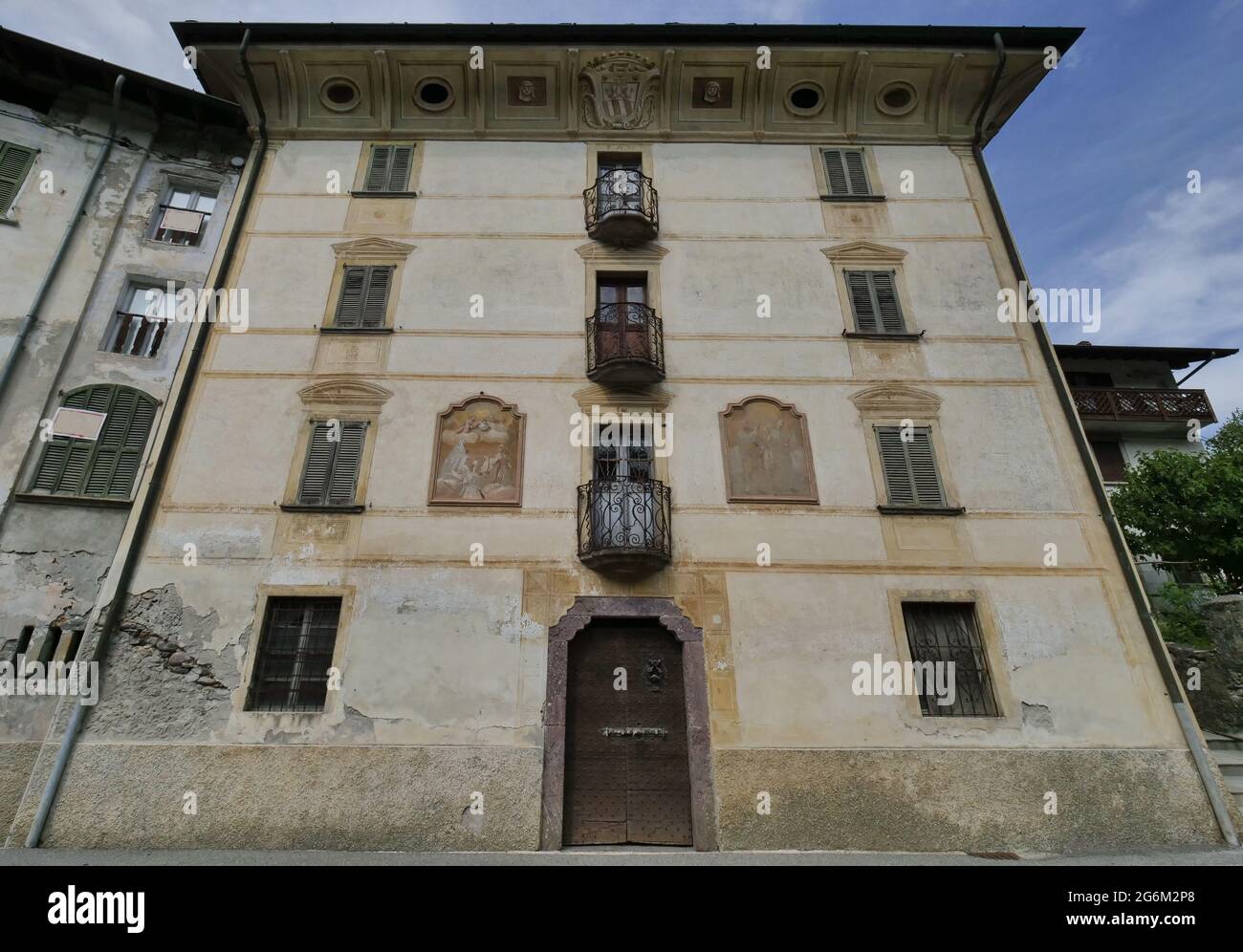 Milesi house with historical Macabre dance decorations on the walls in Cassiglio in Brembana Valley Bergamo, Italy Stock Photo