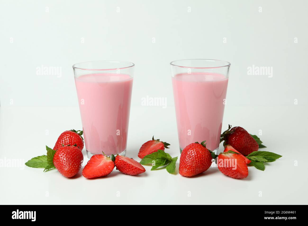 https://c8.alamy.com/comp/2G6M461/glasses-of-strawberry-milkshake-and-ingredients-on-white-background-2G6M461.jpg