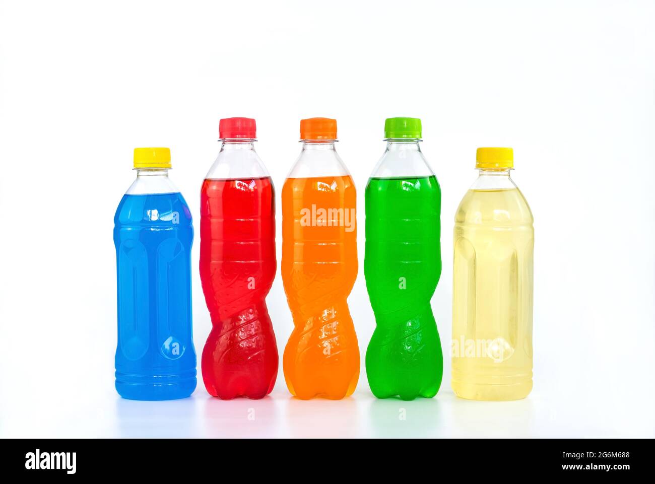 Multi colored drinks in plastic bottles isolated on white background. Stock Photo