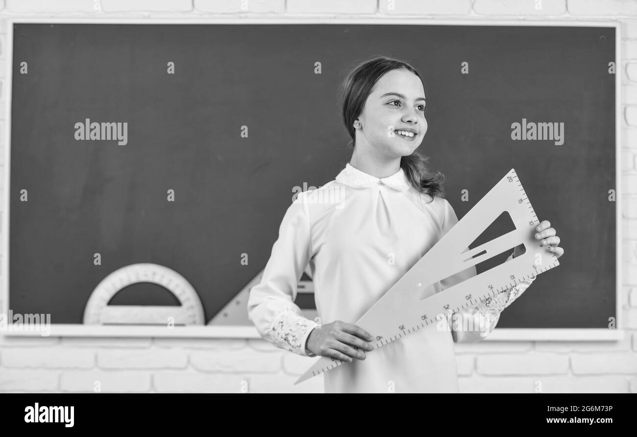 Girl ready to study. Student girl at school. study math with triangle