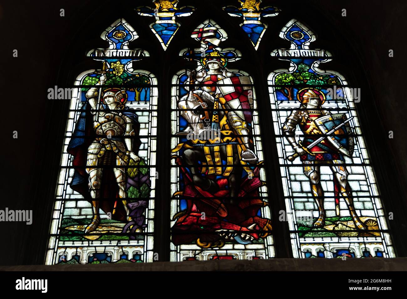 War memorial stained glass window  St George between Victory & Valour in  Norwich cathedral Stock Photo