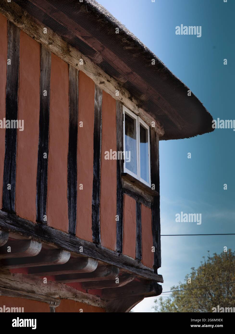 Close up of a corner of Timber framed Thatched house in quintessential picture-postcard Kersey Suffolk England Stock Photo