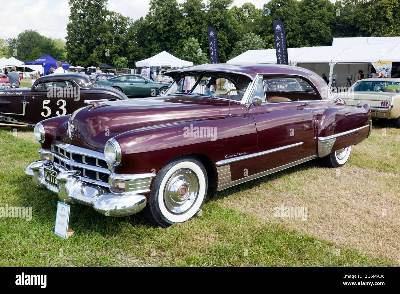 Three-quarters front view of a Maroon, 1949, Cadillac Coupe De Ville, on display at the 2021 London Classic Car Show Stock Photo