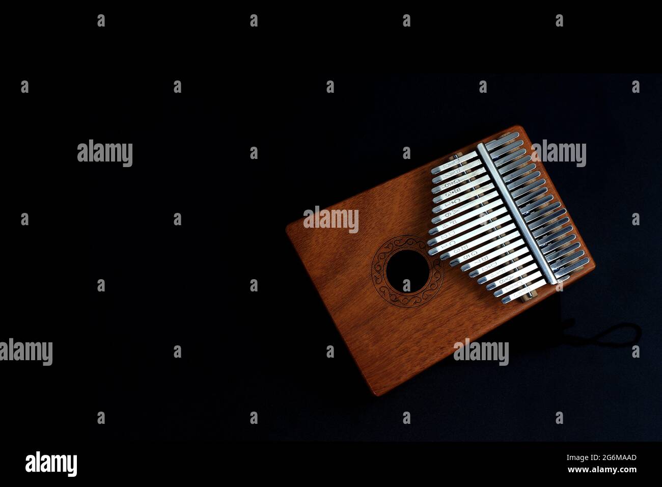 Kalimba, acoustic music instrument from africa and its soft cover at Black Background with negative or copy space Stock Photo