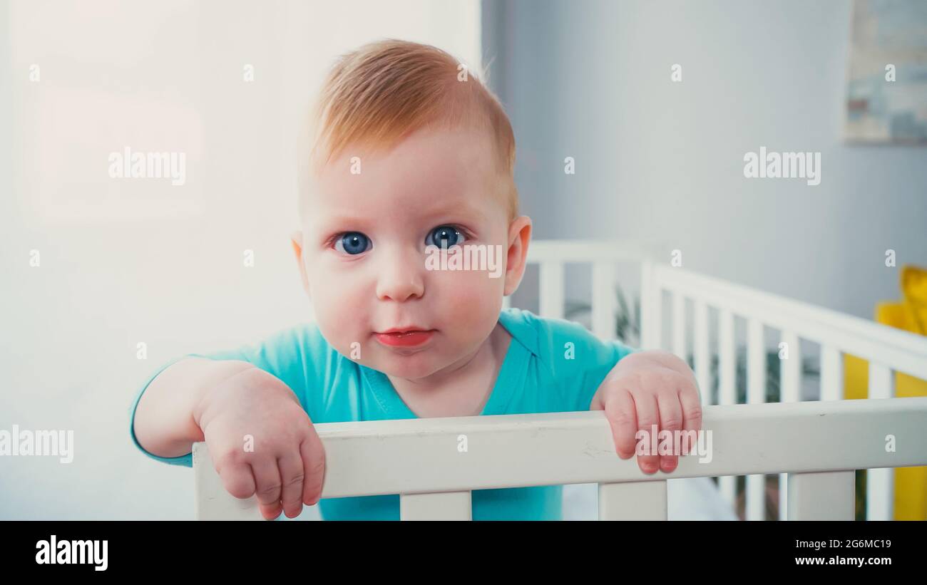 Baby stand crib hires stock photography and images Alamy