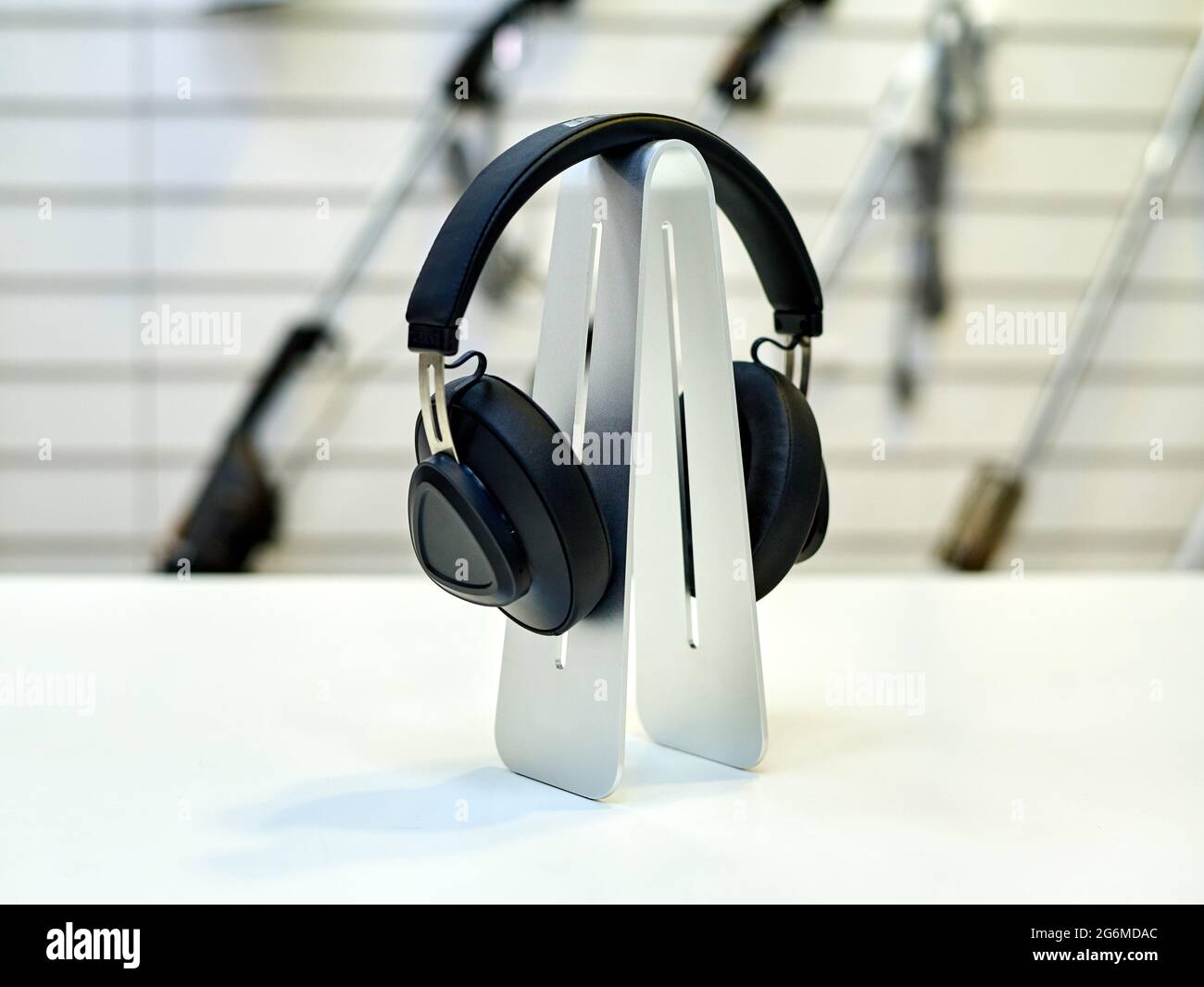 Modern black headphones on a showcase in a store Stock Photo Alamy